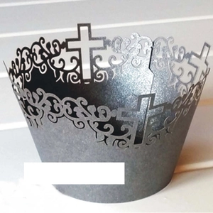 Laser-cut charcoal grey cupcake wrapper featuring ornate religious cross patterns