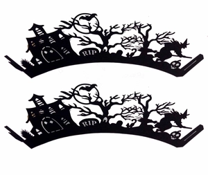 Detail of laser-cut Halloween cupcake wrappers featuring witch, spooky castle and RIP grave