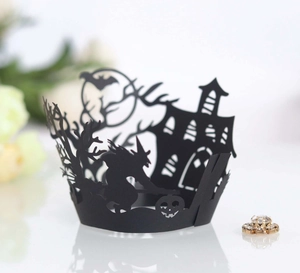 Laser-cut black Halloween cupcake wrapper featuring witch, bat, and castle silhouettes