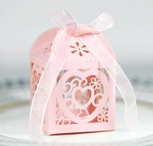 Pink laser cut heart shaped wedding favor gift box with ribbon and floral pattern