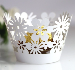 White laser cut floral cupcake wrappers with daisy lace design for wedding party decor
