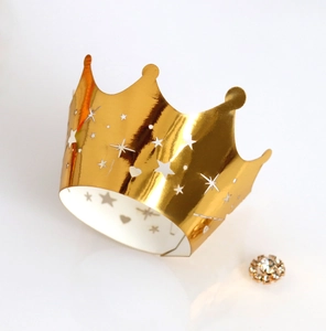 Golden laser-cut crown cake wrapper with hollow stars and hearts for party decoration