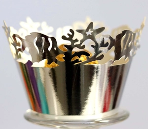 Detail of laser-cut ocean theme cupcake wrapper with fish and coral motifs