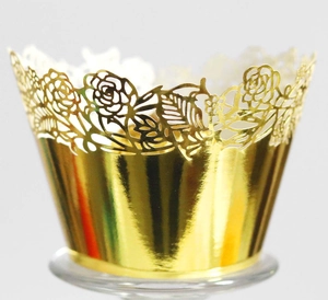 Detailed view of golden laser-cut rose lace cupcake wrappers with metallic finish