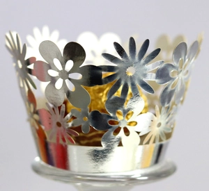 Silver laser cut hollow cupcake wrappers with sunflower pattern and metallic finish
