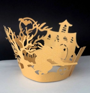 Detailed laser-cut Halloween cupcake liners with witch, castle, and pumpkin motifs