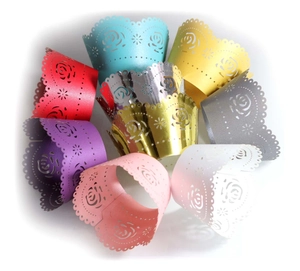 Detailed laser-cut rose patterns on hollow muffin cupcake wrappers in multiple colors