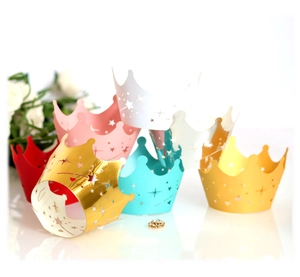 Laser cut cupcake wrappers with crown and star patterns in multiple assorted colors