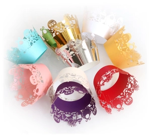 Laser cut baby themed cupcake wrappers in multiple vibrant colors for party decorations