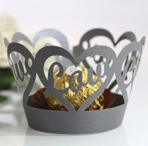 Detail showing laser-cut 'Love' and heart pattern on deep purple cupcake wrapper