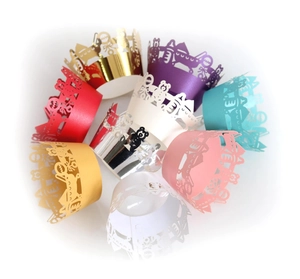 Laser-cut cupcake wrappers with teddy bear and gift box patterns in various vibrant colors