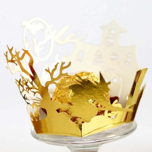 Detailed laser-cut gold Halloween cupcake wrappers with witch and castle designs