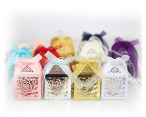 Macro shot of laser-cut rose hollow favor box with elegant organza ribbon bow
