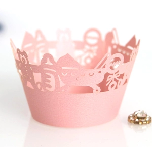 Detailed laser-cut baby shower cupcake wrapper with bear and stroller patterns in pink