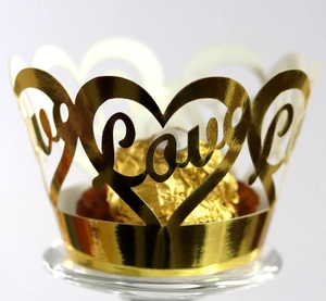 Golden laser-cut lace cupcake wrapper with Love text and heart patterns for party decor