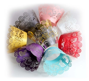 Elegant laser-cut lace cupcake liners in multiple colors for wedding and party decoration