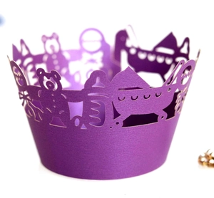 Detailed laser cut purple cupcake wrapper with bear and sailboat hollow patterns