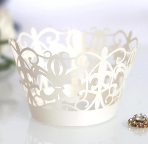 Elegant laser-cut lace cupcake wrappers in cream white with vintage crown vine patterns