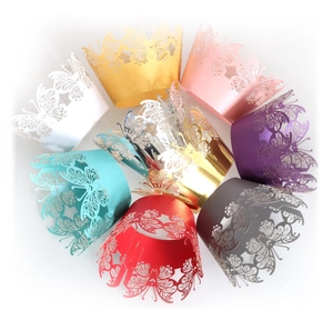 Laser cut butterfly cupcake wrappers in various pearlescent colors for party decor