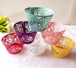 Laser cut heart and floral cake wrappers in purple pink white and more colors