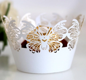Elegant white laser-cut butterfly cupcake wrapper with intricate hollow lace detailing