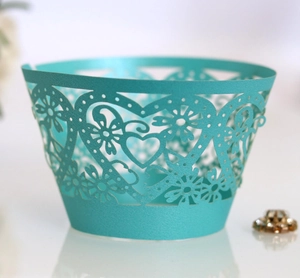 Laser-cut Tiffany blue heart cupcake wrappers with elegant floral lace patterns