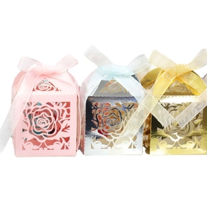Laser-cut rose hollow favor boxes in pink, gold and silver with satin ribbon bows