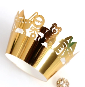 Golden paper party crown with laser-cut baby carriage and teddy bear for birthday decor