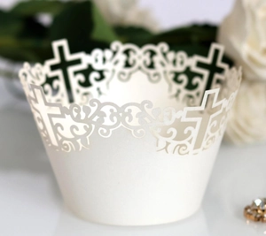 White laser-cut cupcake wrappers with religious cross design for weddings and baptisms