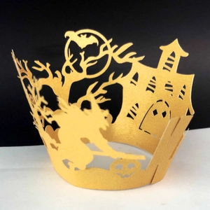 Golden laser-cut Halloween cupcake wrappers with witch castle and bat patterns