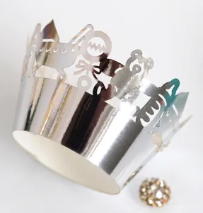 Silver laser-cut muffin cup wrappers with hollow bear and bow patterns for party decor