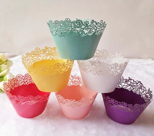 Detailed laser-cut paper cupcake wrappers in six vibrant colors with floral lace texture