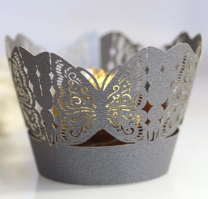 Laser-cut dark purple butterfly cupcake wrapper with intricate floral hollow pattern