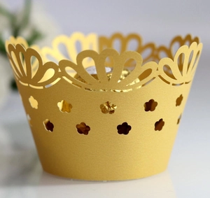 Golden laser-cut cupcake wrapper with crown lace and floral patterns for wedding decor