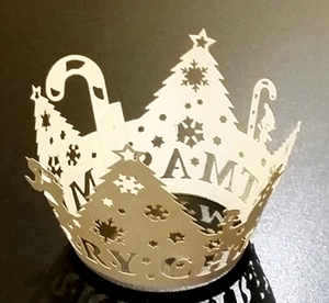 Detailed laser-cut Christmas cupcake wrappers with Merry Christmas snowflake patterns