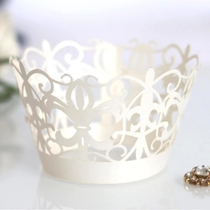 Lace ivory laser cut cupcake wrappers with elegant hollow floral patterns for wedding decor