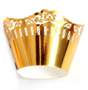 Elegant gold laser-cut lace cupcake wrappers with intricate hollow patterns for wedding