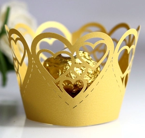 Elegant gold heart laser-cut cupcake wrappers for wedding parties and celebrations