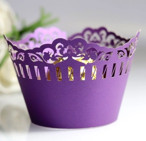 Elegant purple hollow laser-cut cupcake wrappers with floral vine patterns for weddings