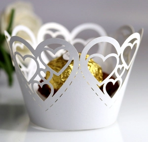 White laser cut heart pattern cupcake wrappers for wedding and party decorations