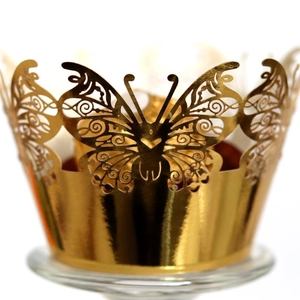 Elegant gold laser-cut cupcake wrapper featuring a hollow butterfly design for weddings