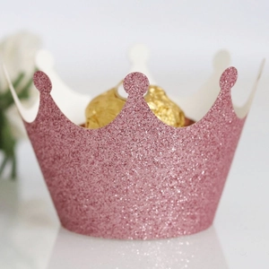 Pink glitter crown cupcake wrappers for weddings with decorative gold foil chocolates