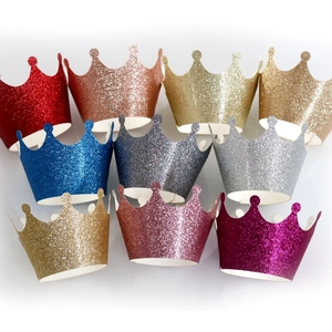 Glitter crown cake wrappers in multiple colors including gold silver and pink for parties