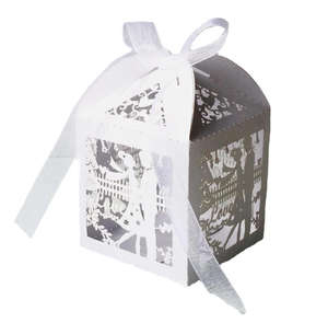 Detailed laser-cut wedding candy box with couple silhouette and white organza ribbon bow