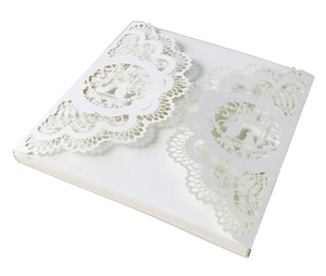 Detailed laser-cut pattern on white square wedding invitation covers stacked together