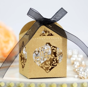 Elegant laser-cut hollow heart leaf paper gift box with black ribbon and floral decoration