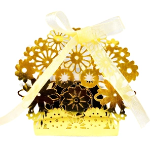 Golden laser cut favor box with floral patterns and yellow ribbon for wedding and party