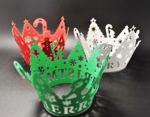 Laser-cut Christmas tree and snowflake patterns on festive cupcake wrappers in red and green