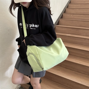 Large light green nylon tote bag with wide strap for casual daily commuting