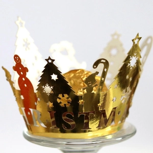 Golden laser-cut Christmas cupcake wrapper with festive tree and snowman patterns